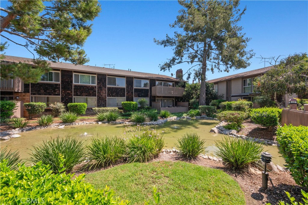 1044 Cabrillo Park Drive, Unit B Santa Ana, CA 92701 - Photo 31 of 49 a front view of house with yard and green space