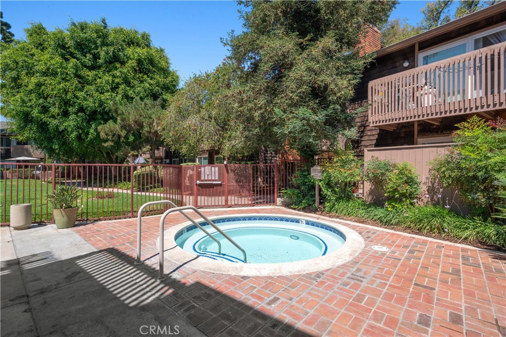 1044 Cabrillo Park Drive, Unit B Santa Ana, CA 92701 - Photo 36 of 49 a view of a swimming pool with a patio