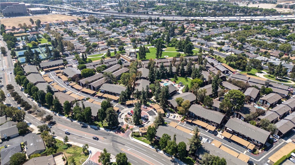 1044 Cabrillo Park Drive, Unit B Santa Ana, CA 92701 - Photo 45 of 49 an aerial view of a city with lots of residential buildings