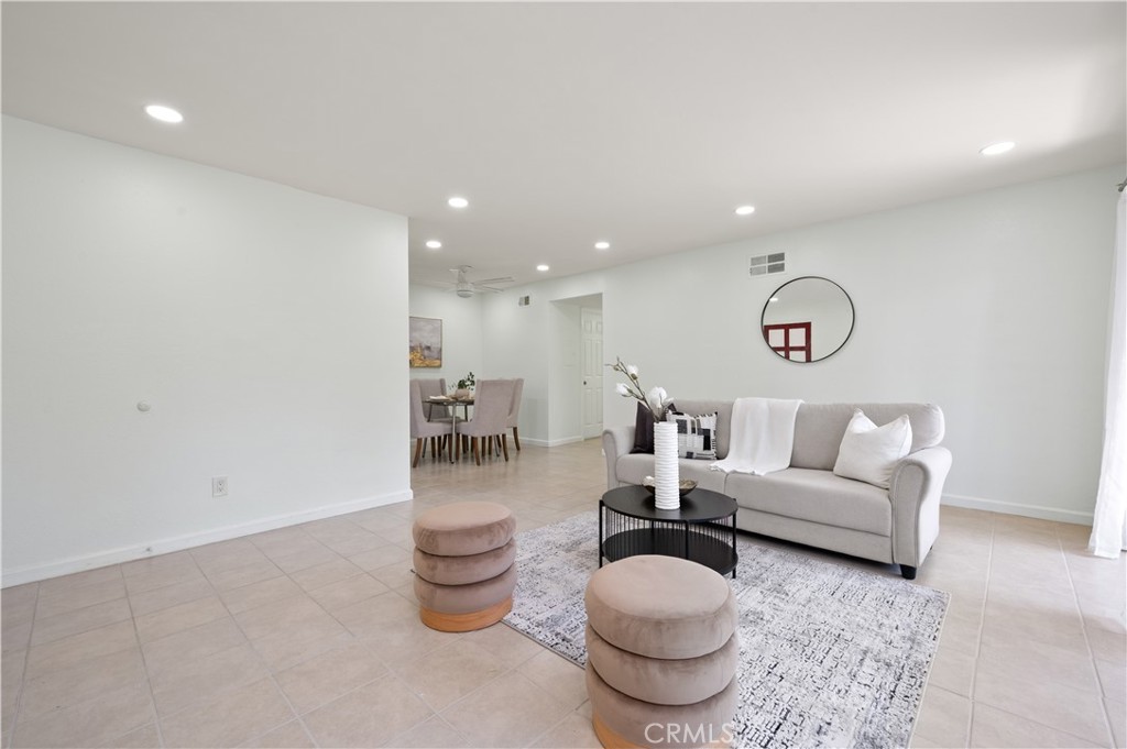 1044 Cabrillo Park Drive, Unit B Santa Ana, CA 92701 - Photo 6 of 49 a living room with furniture and a potted plant