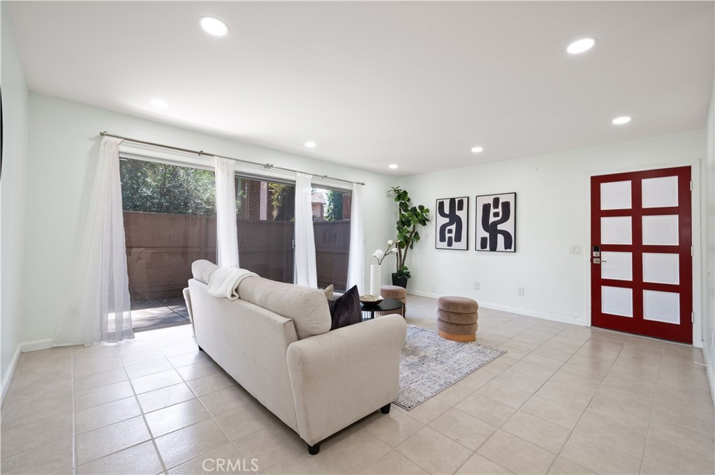 1044 Cabrillo Park Drive, Unit B Santa Ana, CA 92701 - Photo 7 of 49 a living room with furniture and large window