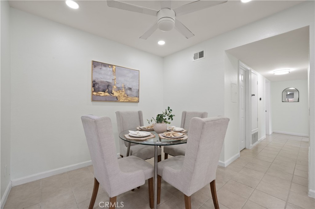 1044 Cabrillo Park Drive, Unit B Santa Ana, CA 92701 - Photo 10 of 49 a view of a dining room with furniture and wooden floor