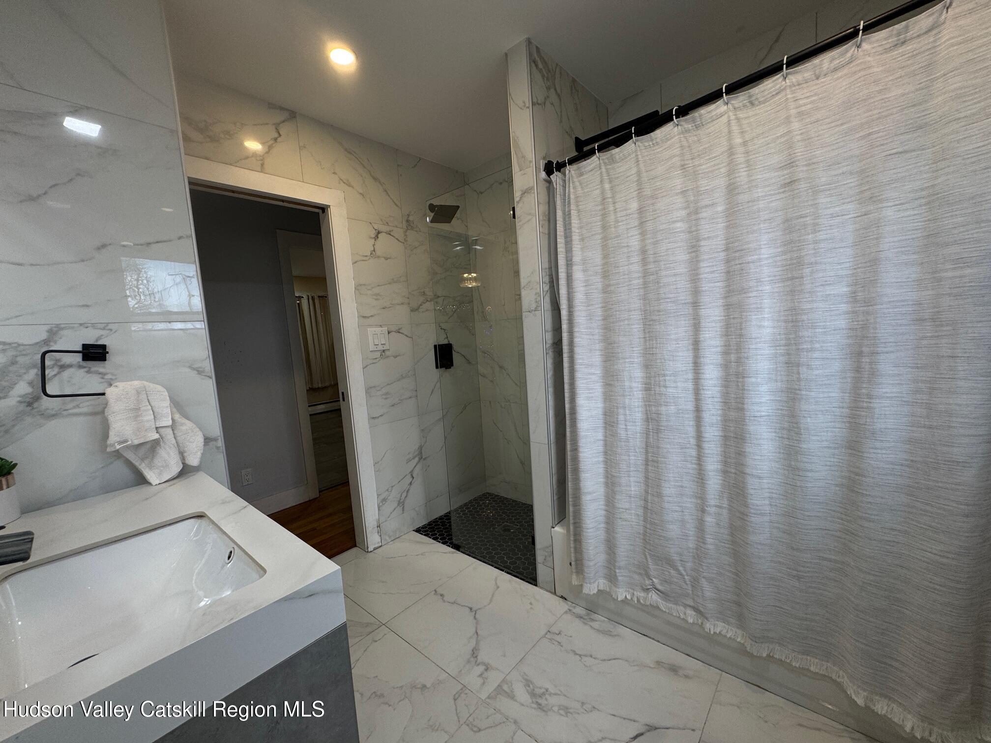 2 Spaulding Lane Saugerties, NY 12477 - Photo 18 of 24 a bathroom with a sink and a mirror