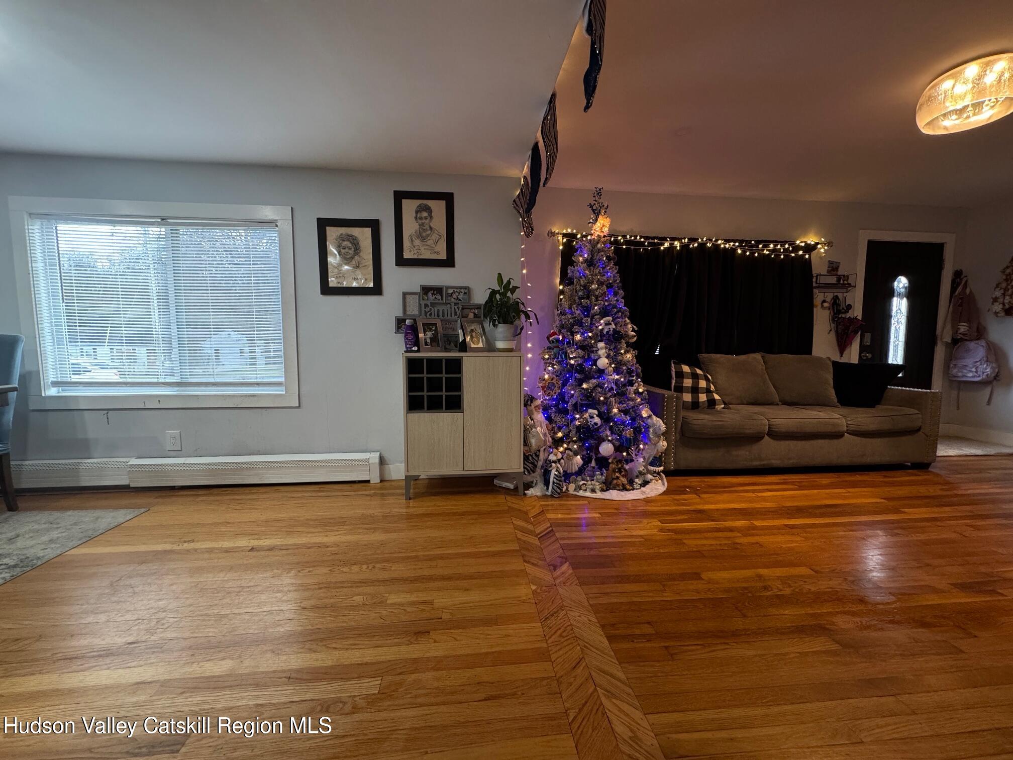 2 Spaulding Lane Saugerties, NY 12477 - Photo 8 of 24 a view of a livingroom with furniture window and a fireplace