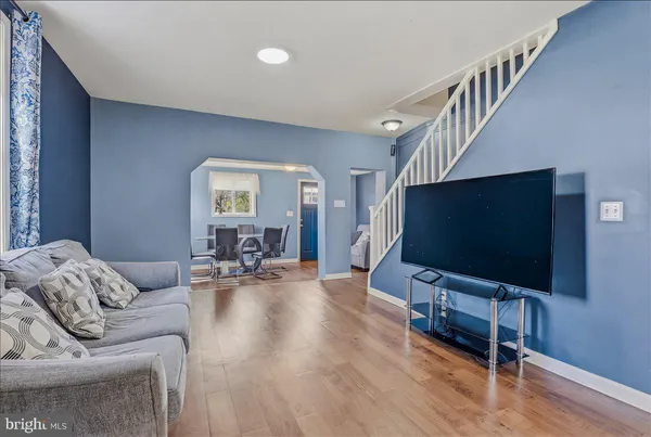 a living room with furniture and a flat screen tv