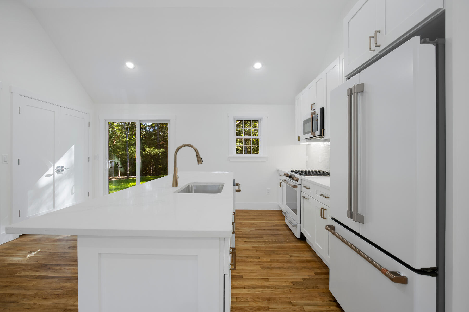 42 Sandy Valley Road Marstons Mills, MA 02648 - Photo 11 of 43 a kitchen with stainless steel appliances granite countertop a sink and a refrigerator