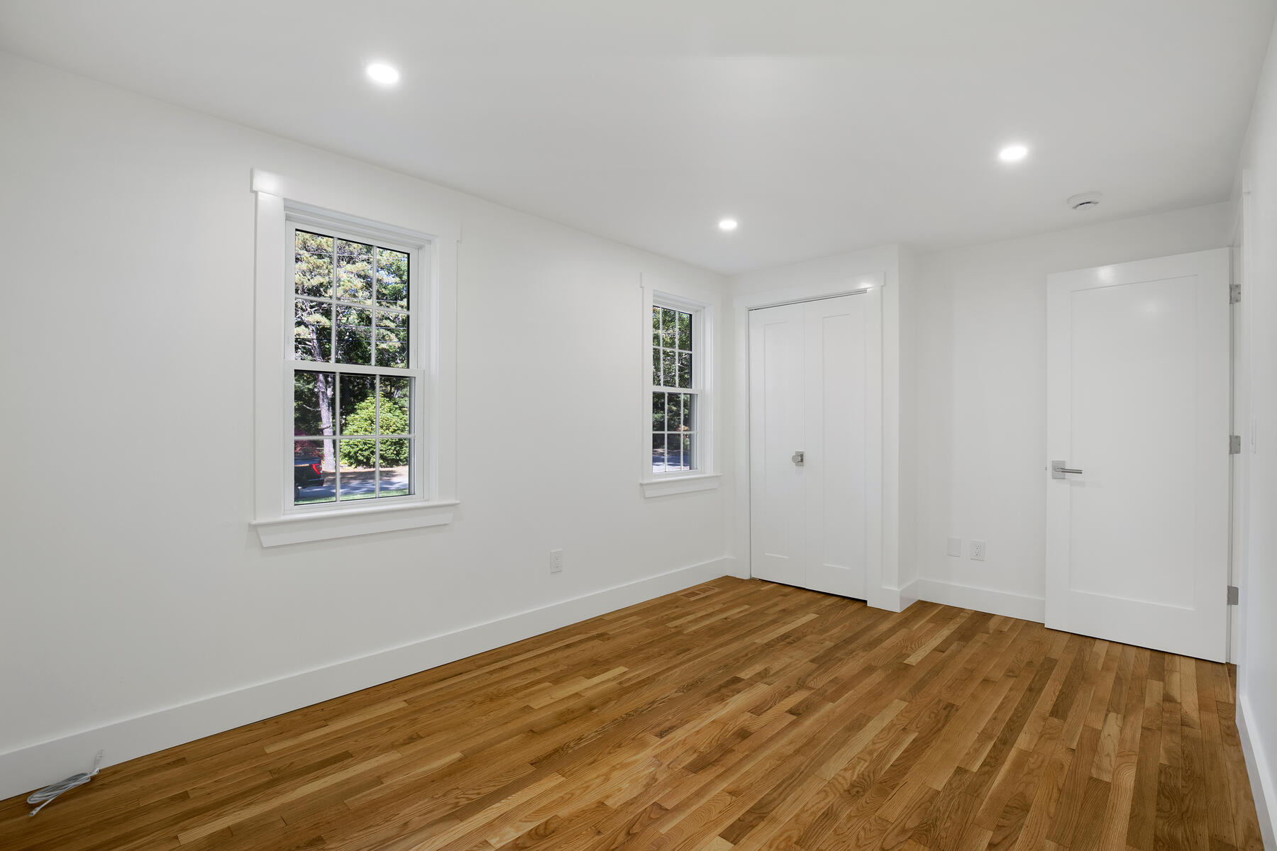 42 Sandy Valley Road Marstons Mills, MA 02648 - Photo 20 of 43 a view of empty room with wooden floor and fan