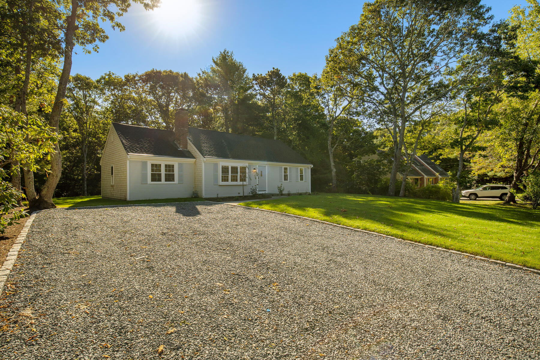 42 Sandy Valley Road Marstons Mills, MA 02648 - Photo 2 of 43 a house view with swimming pool in front of it