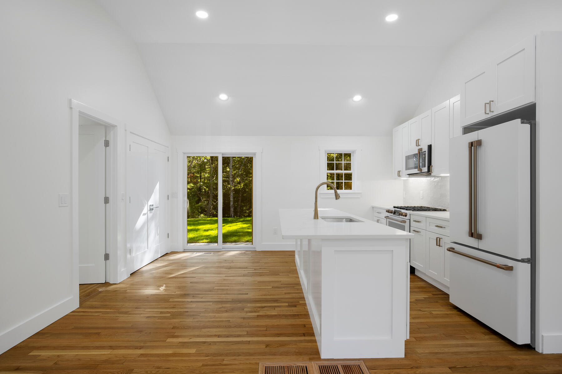 42 Sandy Valley Road Marstons Mills, MA 02648 - Photo 10 of 43 a kitchen with stainless steel appliances a refrigerator and a stove top oven