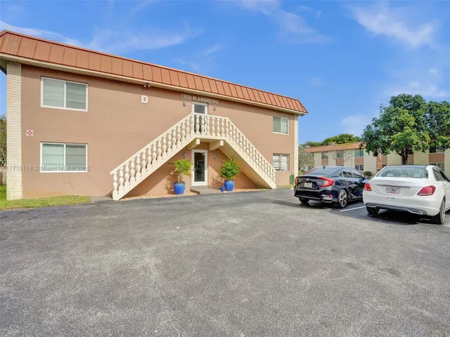 a view of car parked in front of house