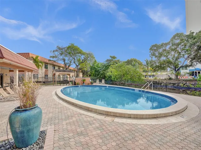 a view of outdoor space and swimming pool