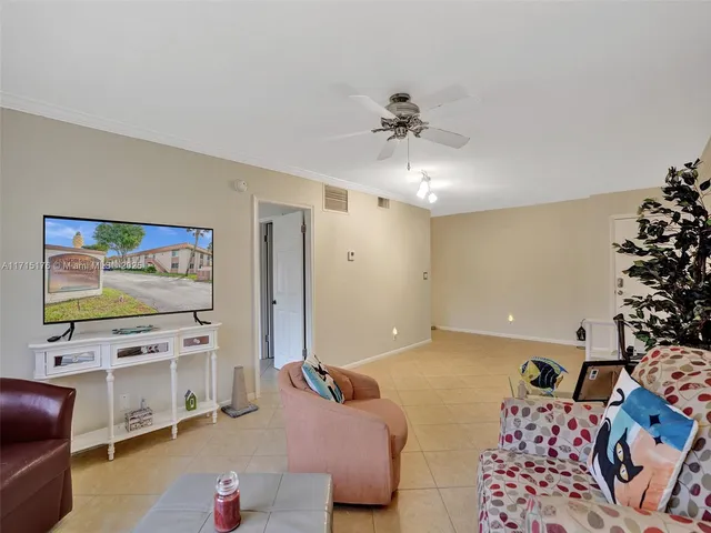 a bedroom with furniture and a flat screen tv