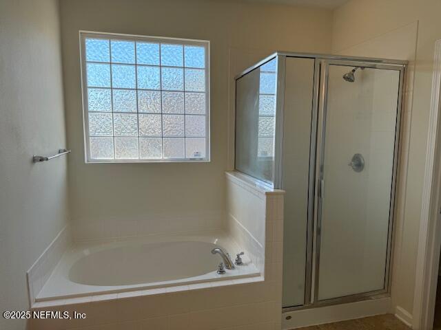9688 Woodstone Mill Jacksonville, FL 32244 - Photo 15 of 19 a bathroom with a shower and a bathtub