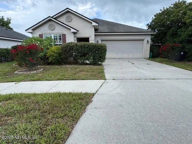 a front view of house with a yard