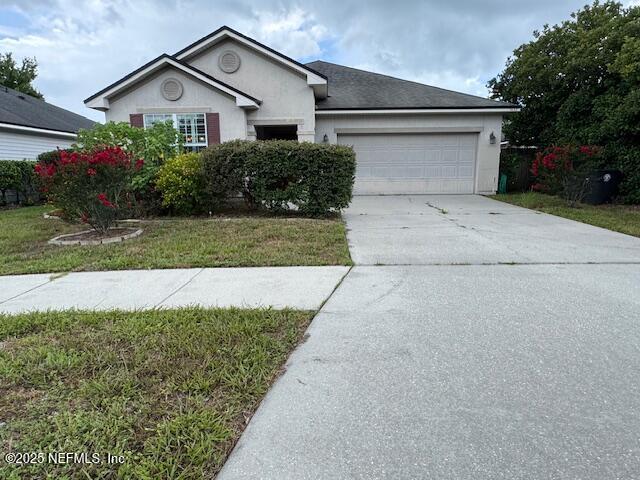 9688 Woodstone Mill Jacksonville, FL 32244 - Photo 2 of 19 a front view of house with a yard
