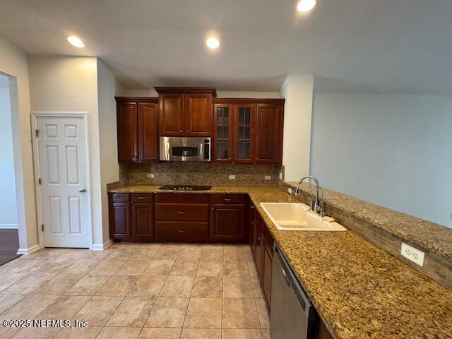 9688 Woodstone Mill Jacksonville, FL 32244 - Photo 5 of 19 a large kitchen with kitchen island granite countertop a sink and refrigerator