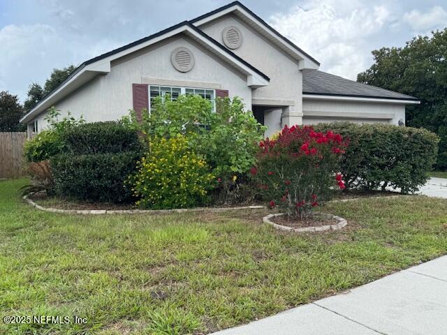 9688 Woodstone Mill Jacksonville, FL 32244 - Photo 6 of 19 a front view of a house with a yard