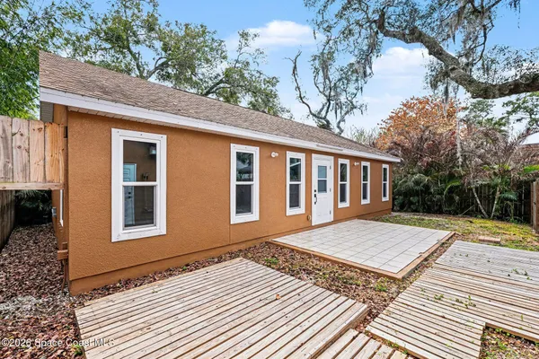 a view of backyard with a patio