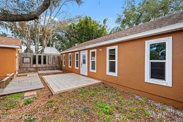 a view of backyard with deck