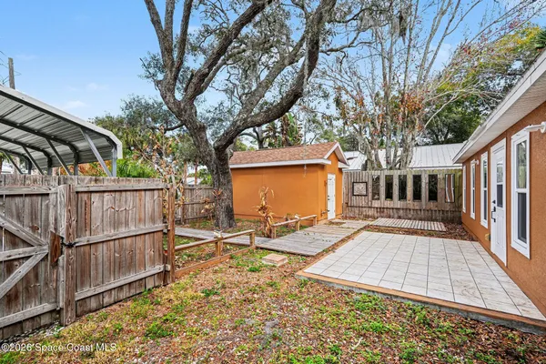 a view of backyard with deck