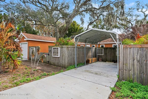 a backyard of a house with seating space