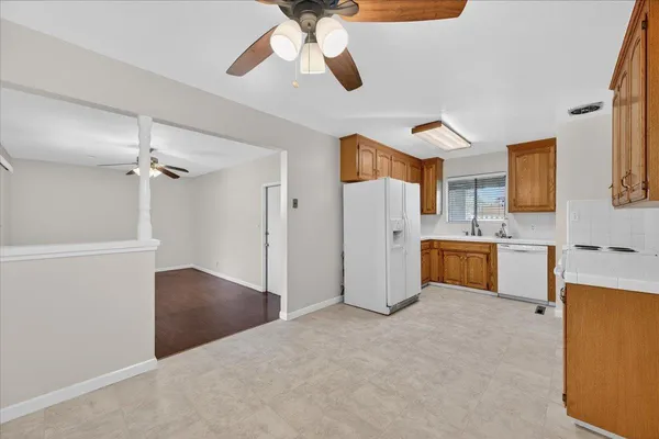 a kitchen with a stove cabinets and a microwave oven