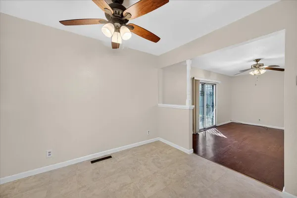 a view of an empty room with a window