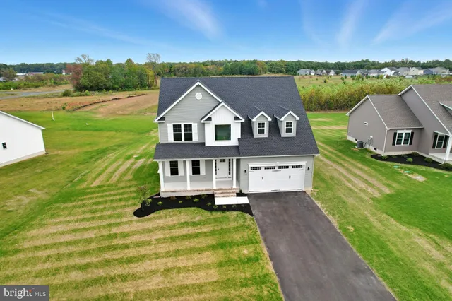 a aerial view of a house with big yard