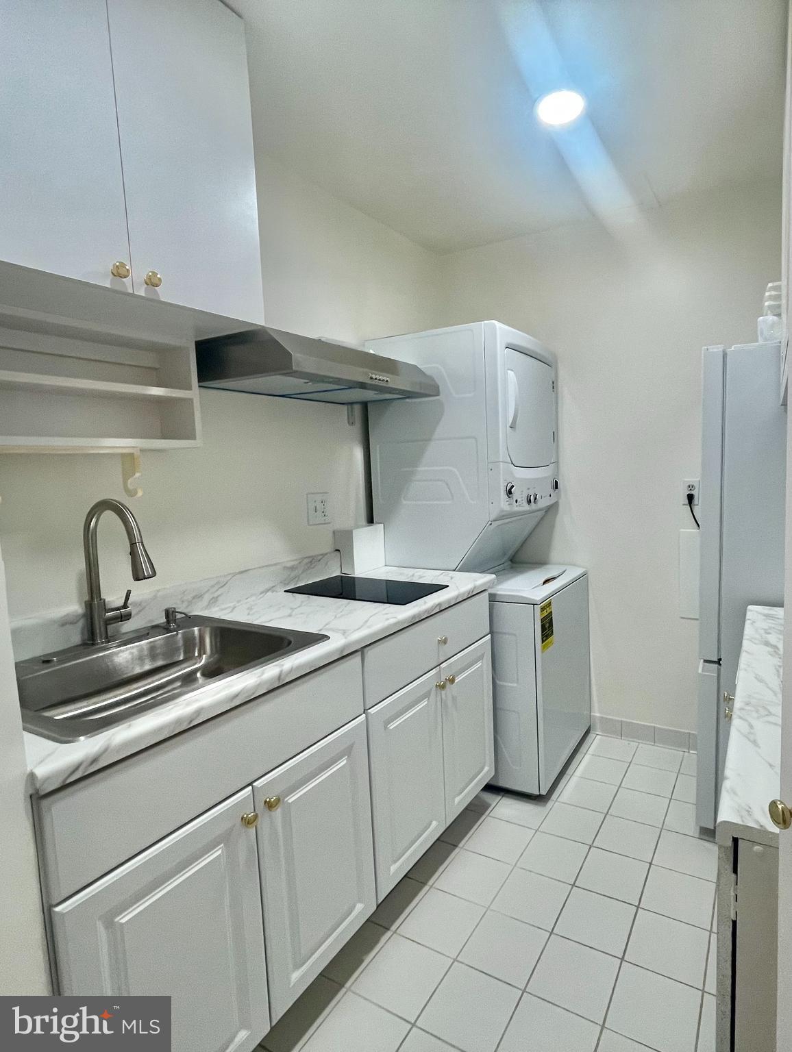 8526 Raglan Road Vienna, VA 22182 - Photo 11 of 12 a kitchen with a sink and cabinets