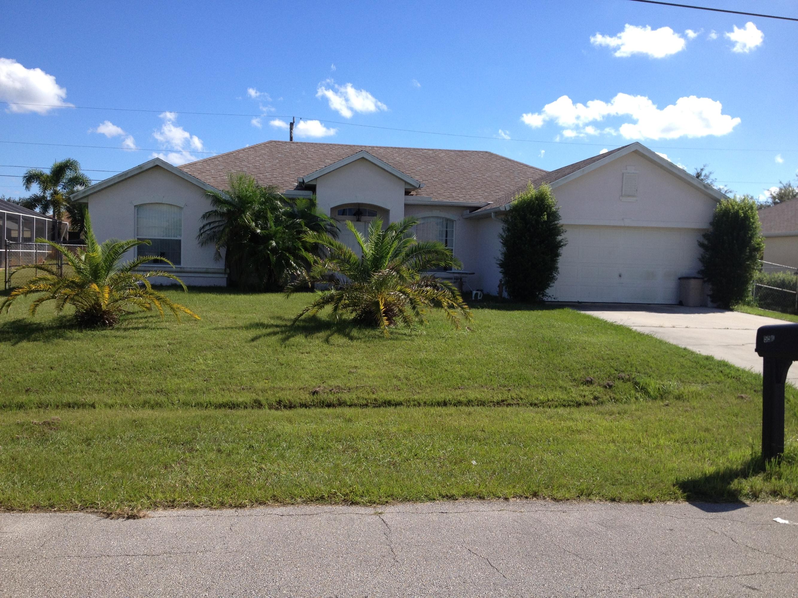 554 Southwest Halkell Avenue Port St. Lucie, FL 34953 - Photo 1 of 13 Front