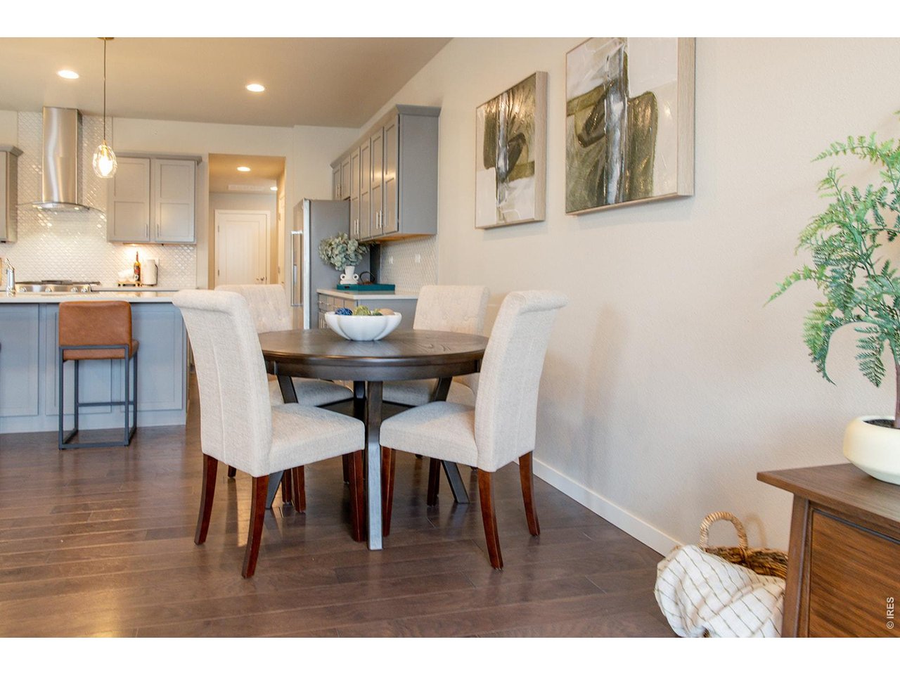 3044 Comet Street Fort Collins, CO 80524 - Photo 15 of 50 Located between the kitchen and living room, the dining area is the perfect spot for shared meals, conversation, and connection.