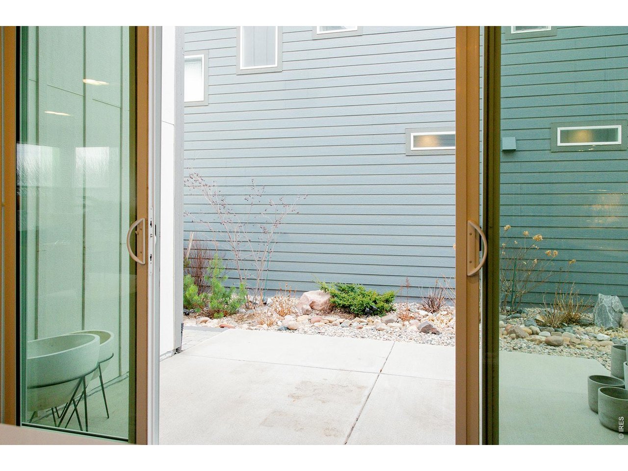3044 Comet Street Fort Collins, CO 80524 - Photo 41 of 50 Expansive patio doors open seamlessly to offer the perfect setting for quiet mornings or effortless entertaining.