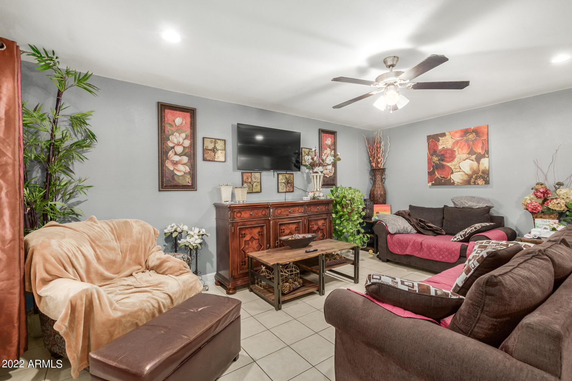 2726 West Taylor Street Phoenix, AZ 85009 - Photo 11 of 26 a living room with furniture a flat screen tv and a window