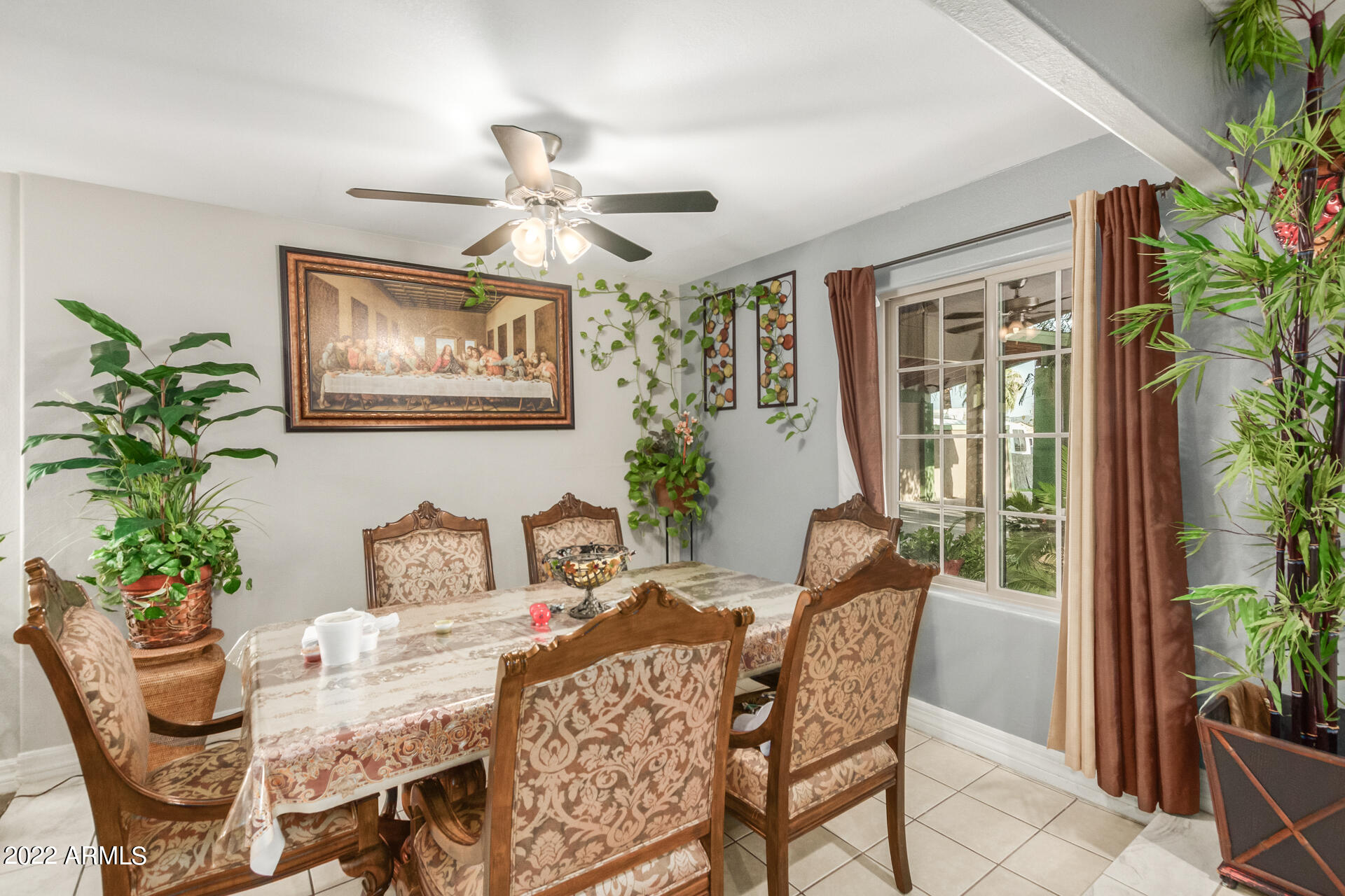 2726 West Taylor Street Phoenix, AZ 85009 - Photo 13 of 26 a dining room with furniture potted plants and wooden floor
