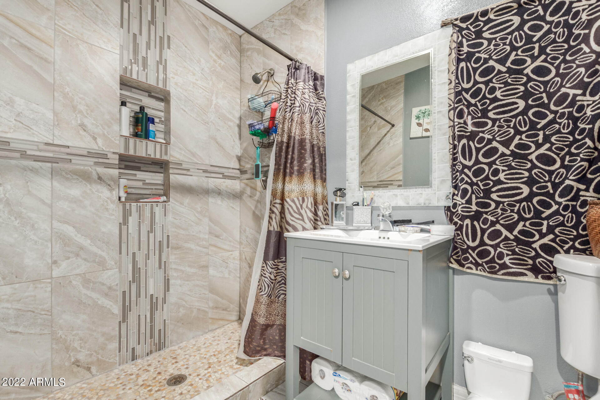 2726 West Taylor Street Phoenix, AZ 85009 - Photo 21 of 26 a bathroom with a sink toilet and shower