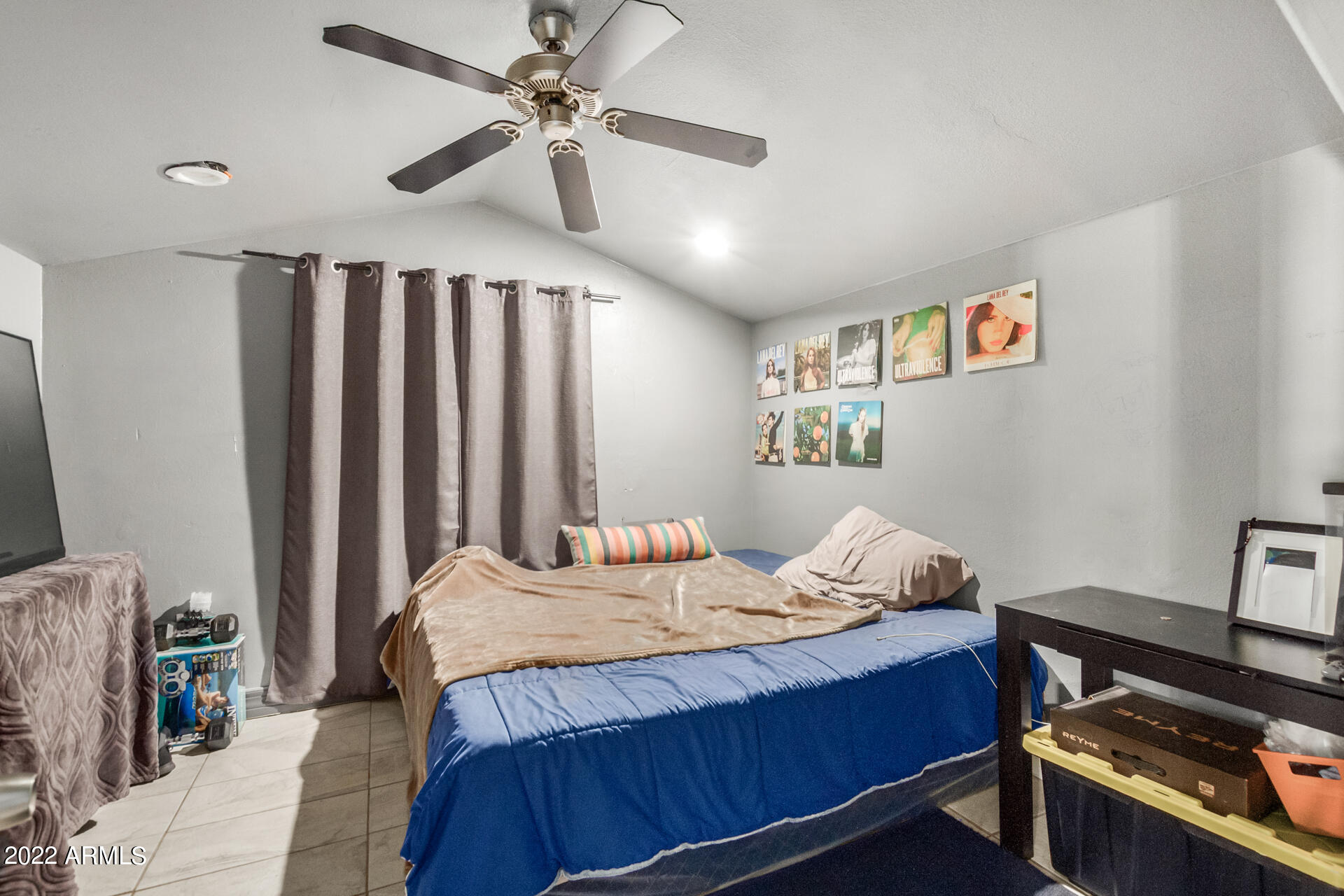 2726 West Taylor Street Phoenix, AZ 85009 - Photo 23 of 26 a bedroom with a bed and a ceiling fan