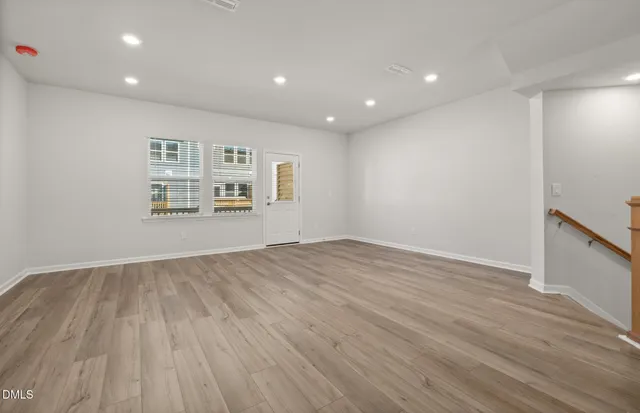 a view of entryway with wooden floor