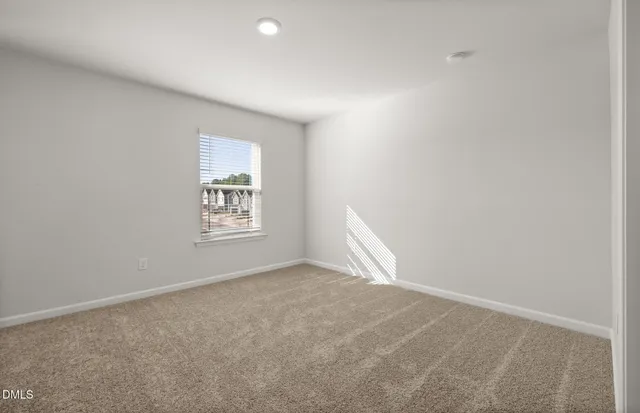 a bathroom with a toilet a sink a mirror and shower