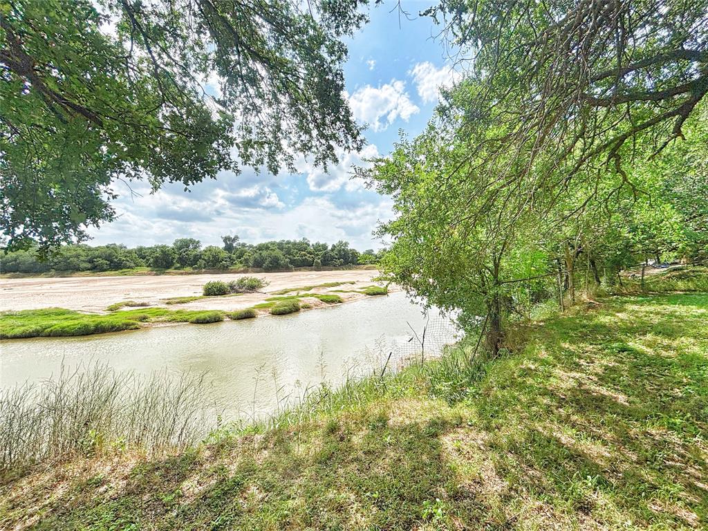 101 Riverview Road Millsap, TX 76066 - Photo 14 of 26 a view of a lake with houses in the background