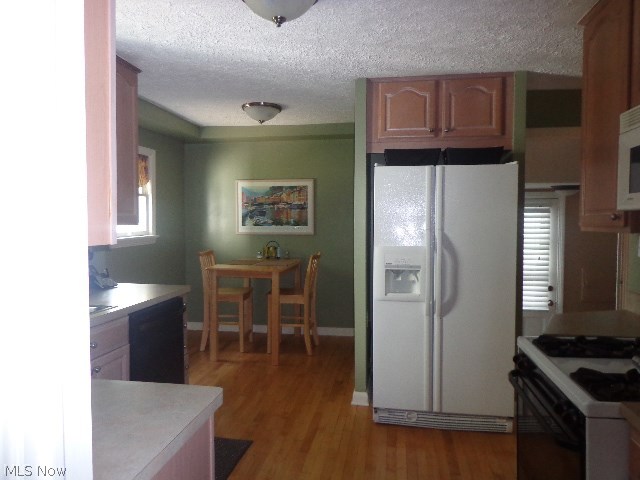 4366 Silsby Road University Heights, OH 44118 - Photo 8 of 23 Hardwood floor in the kitchen easily entered to by the side door.