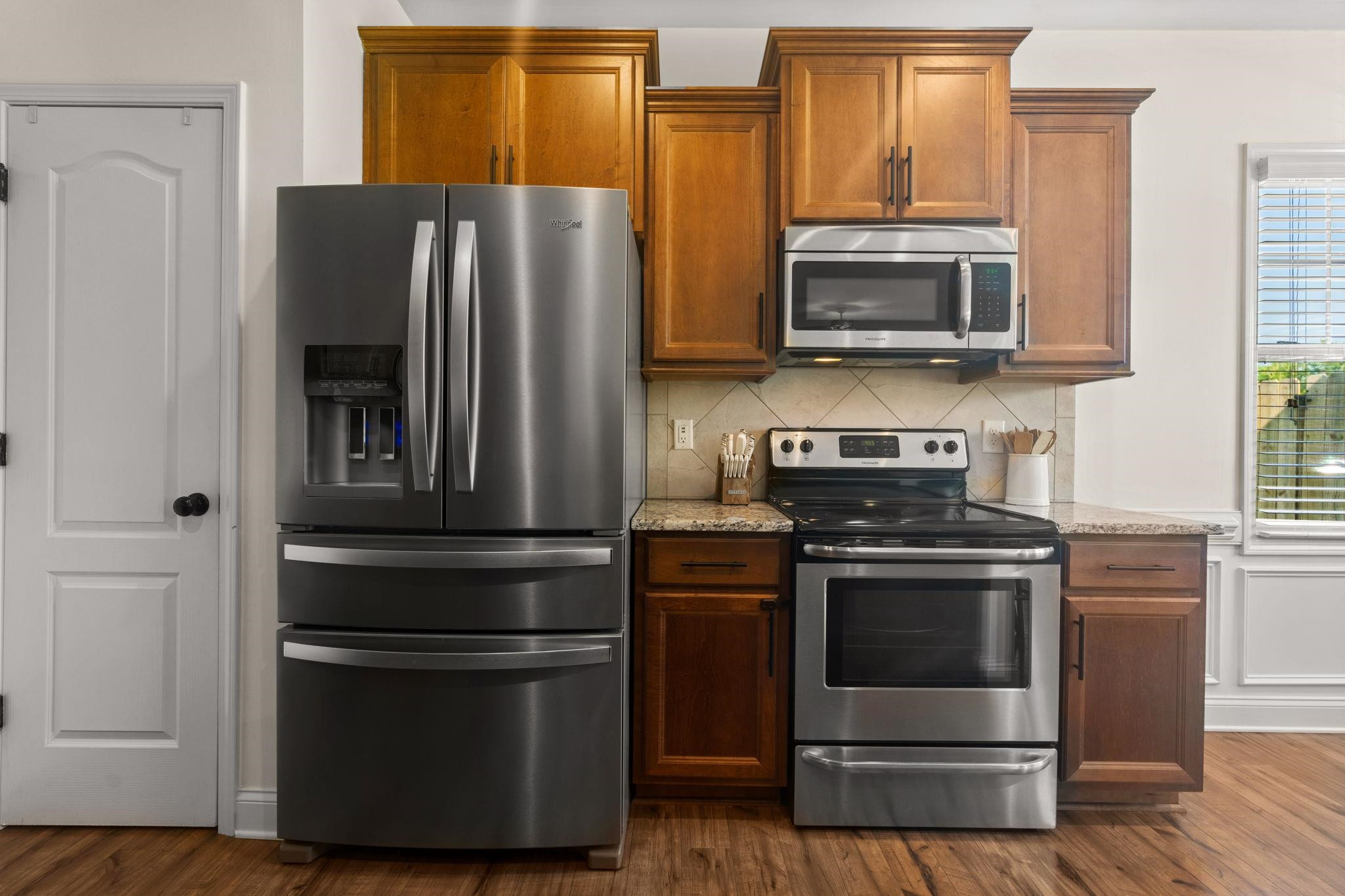 139 Torchie Drive Selma, NC 27576 - Photo 16 of 49 a kitchen with stainless steel appliances and wooden floor