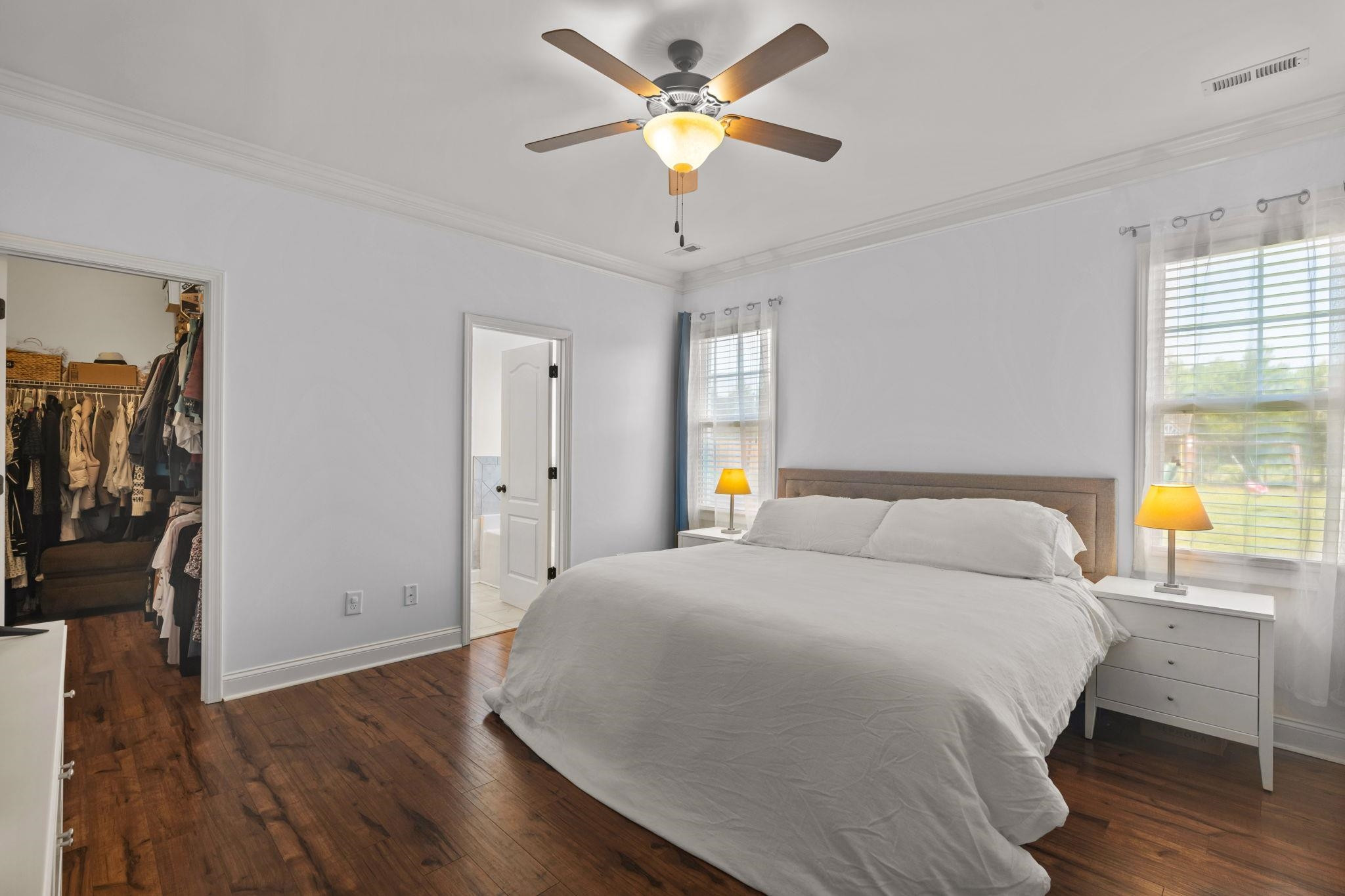 139 Torchie Drive Selma, NC 27576 - Photo 19 of 49 a bedroom with a bed and a chandelier