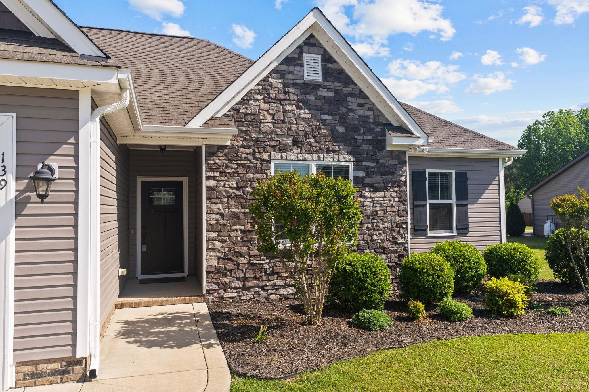 139 Torchie Drive Selma, NC 27576 - Photo 2 of 49 a front view of a house with garden