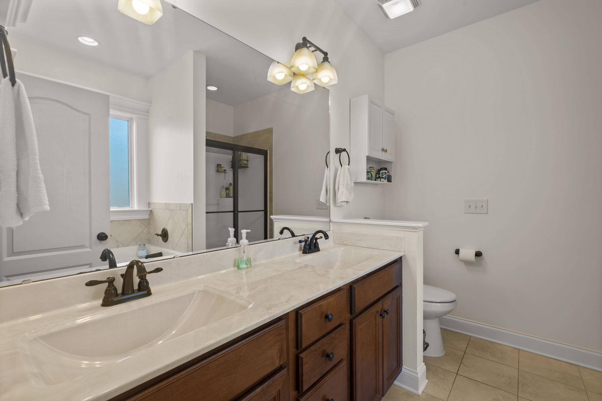 139 Torchie Drive Selma, NC 27576 - Photo 22 of 49 a bathroom with a sink vanity toilet and a mirror