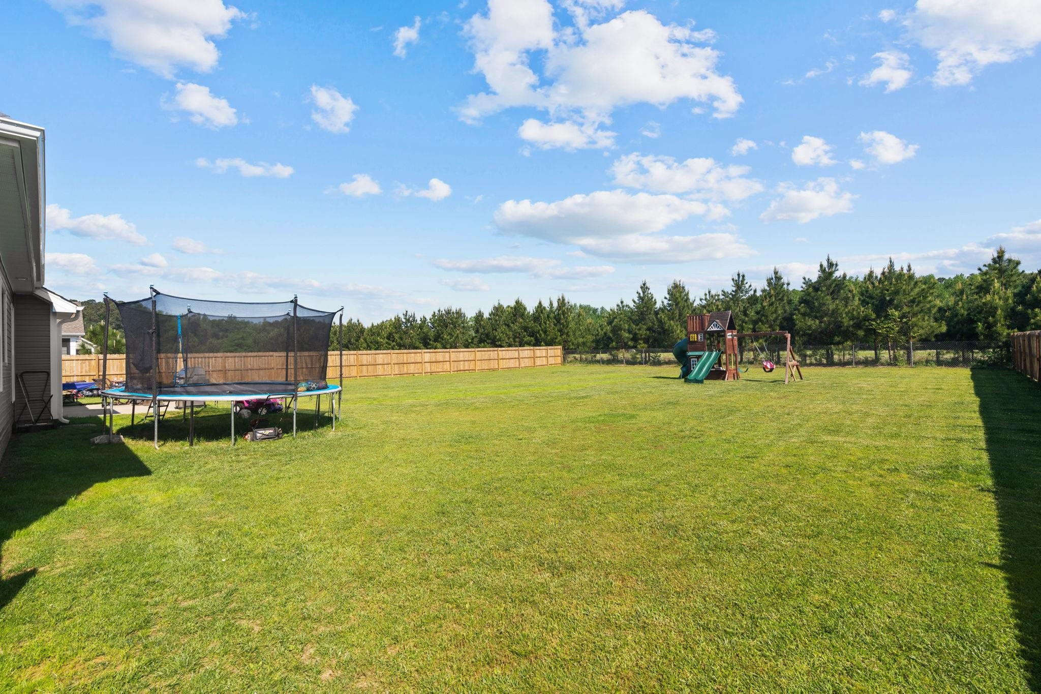 139 Torchie Drive Selma, NC 27576 - Photo 40 of 49 a view of a lake with a big yard