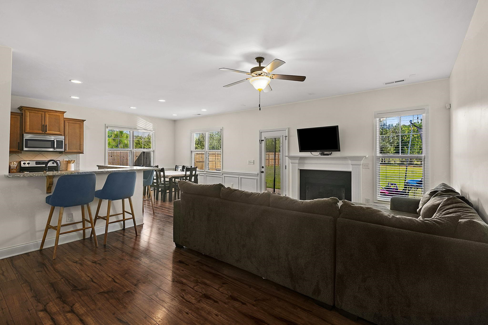 139 Torchie Drive Selma, NC 27576 - Photo 4 of 49 a living room with furniture a fireplace and a flat screen tv