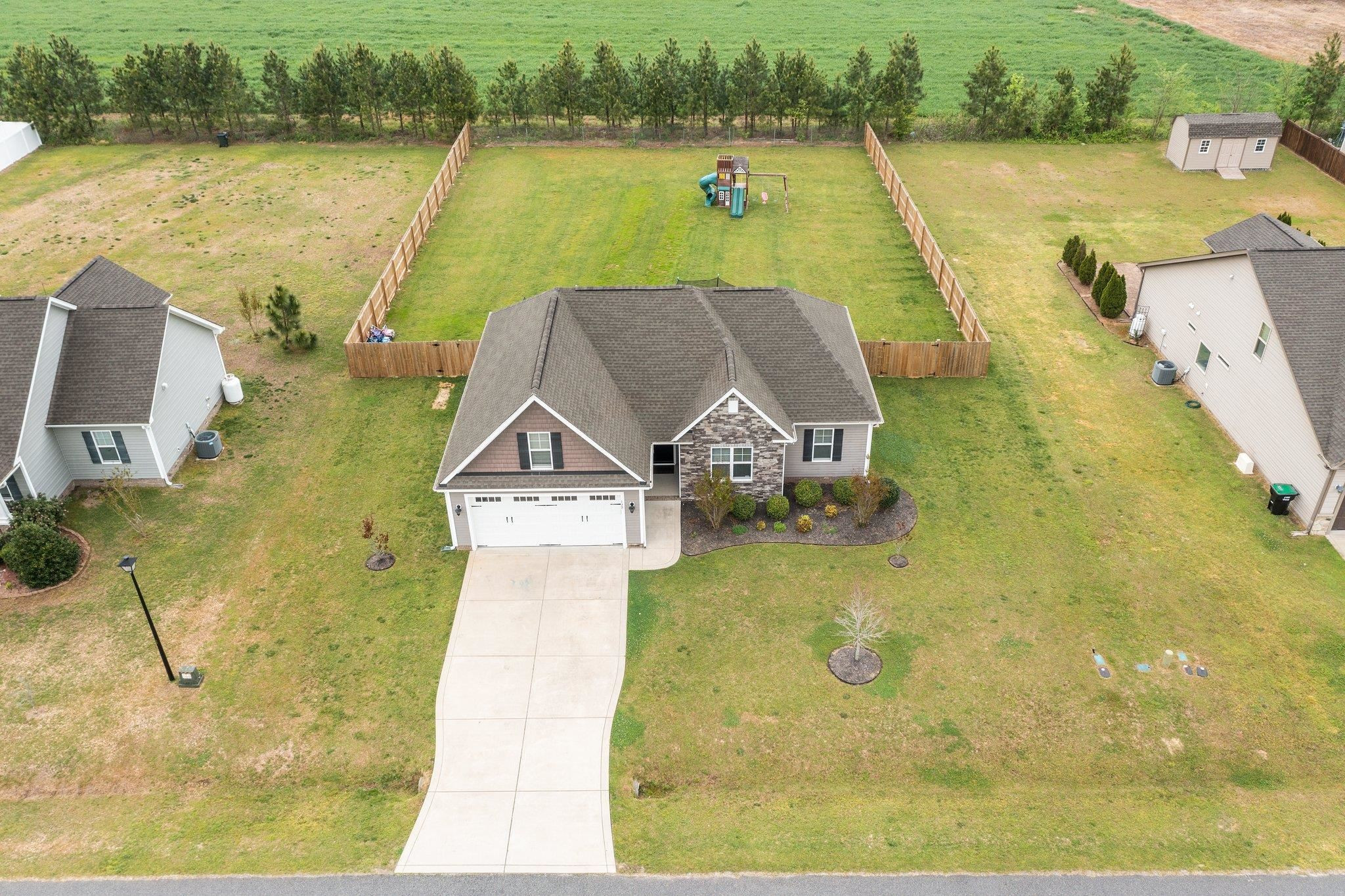 139 Torchie Drive Selma, NC 27576 - Photo 43 of 49 an aerial view of a house with a lake view
