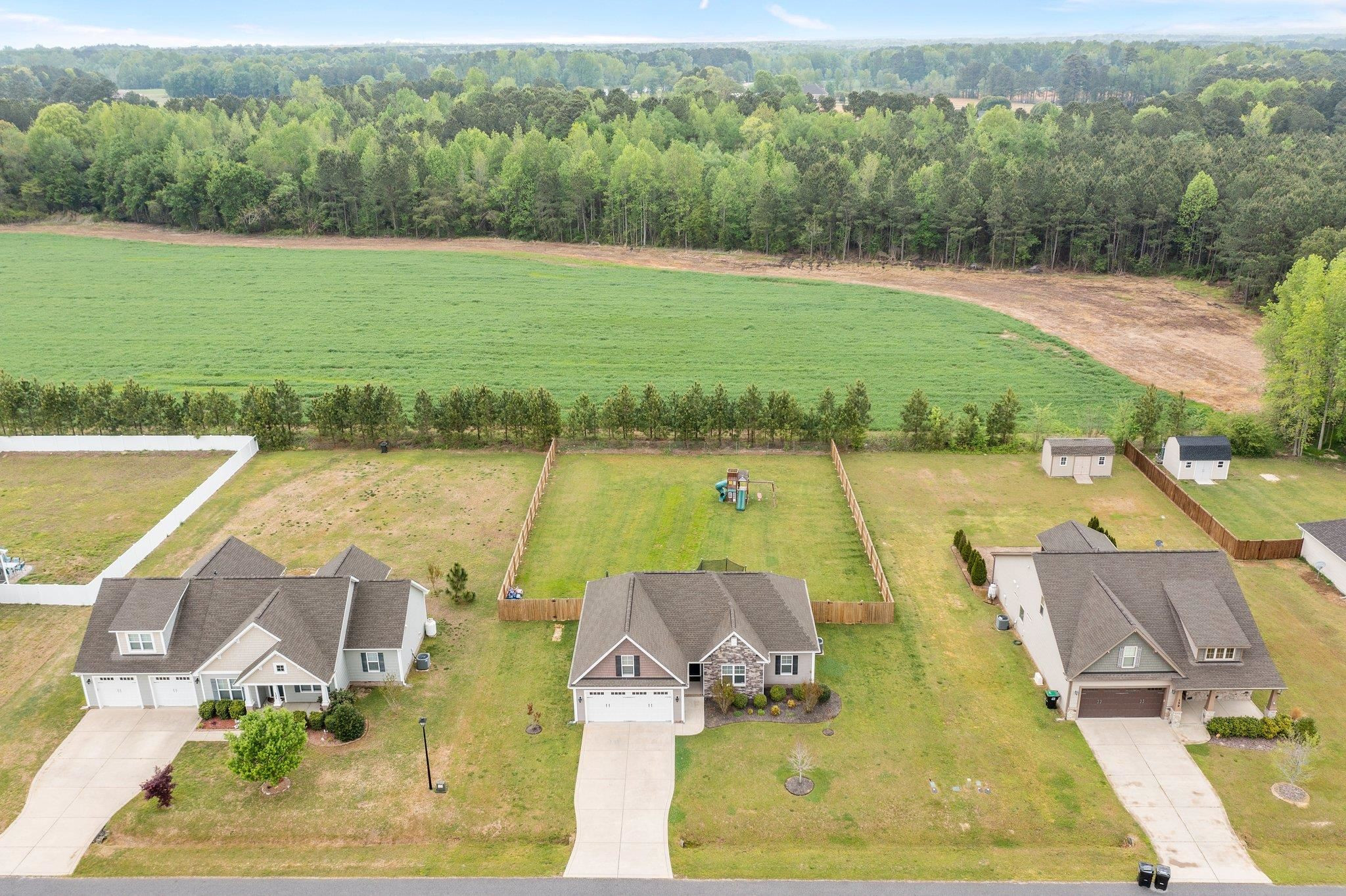 139 Torchie Drive Selma, NC 27576 - Photo 46 of 49 an aerial view of a house with a lake view
