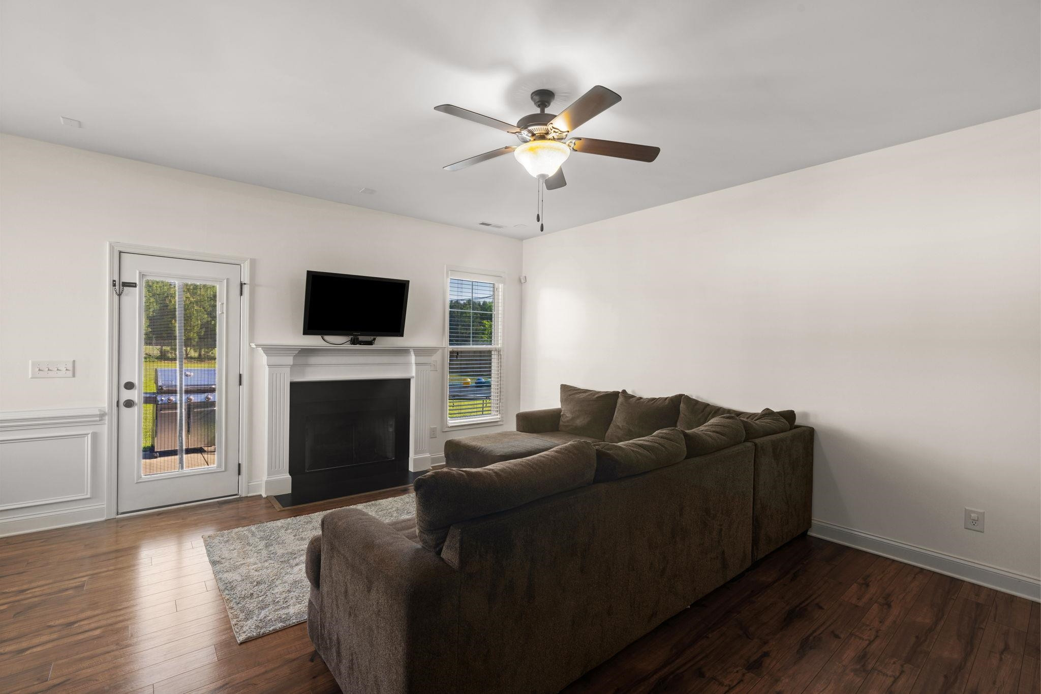 139 Torchie Drive Selma, NC 27576 - Photo 5 of 49 a living room with furniture a fireplace and a flat screen tv