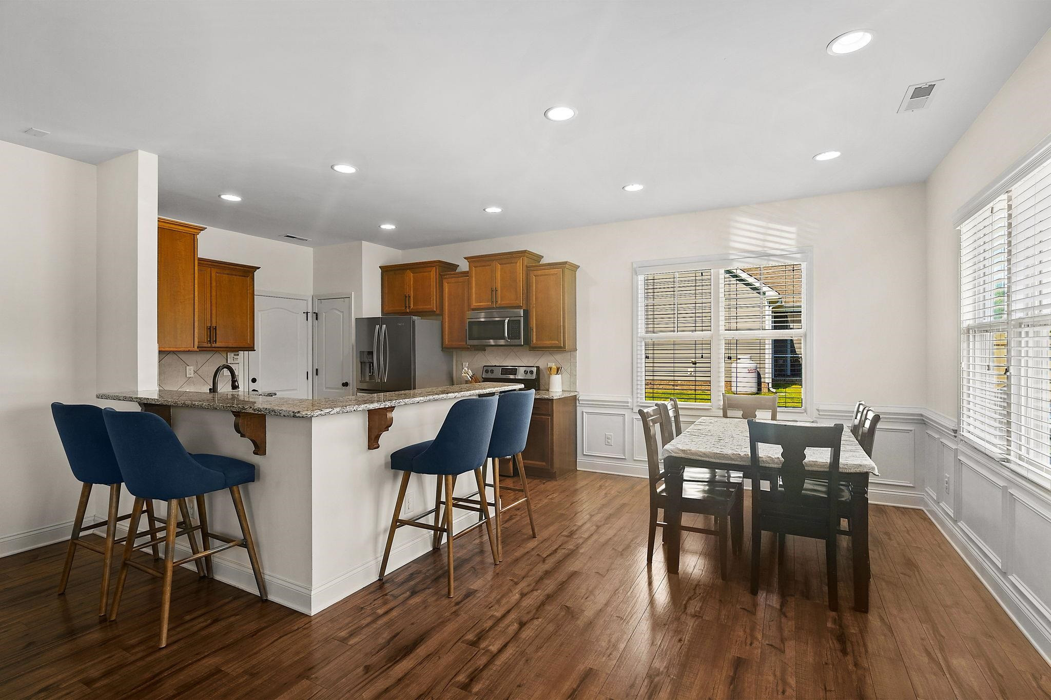 139 Torchie Drive Selma, NC 27576 - Photo 9 of 49 a view of a dining room with furniture window and wooden floor